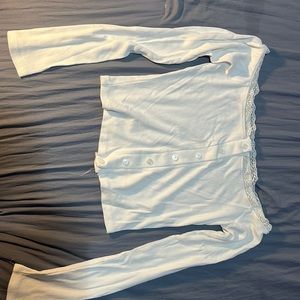 Cute shirt with buttons down the middle and a cute lace on top